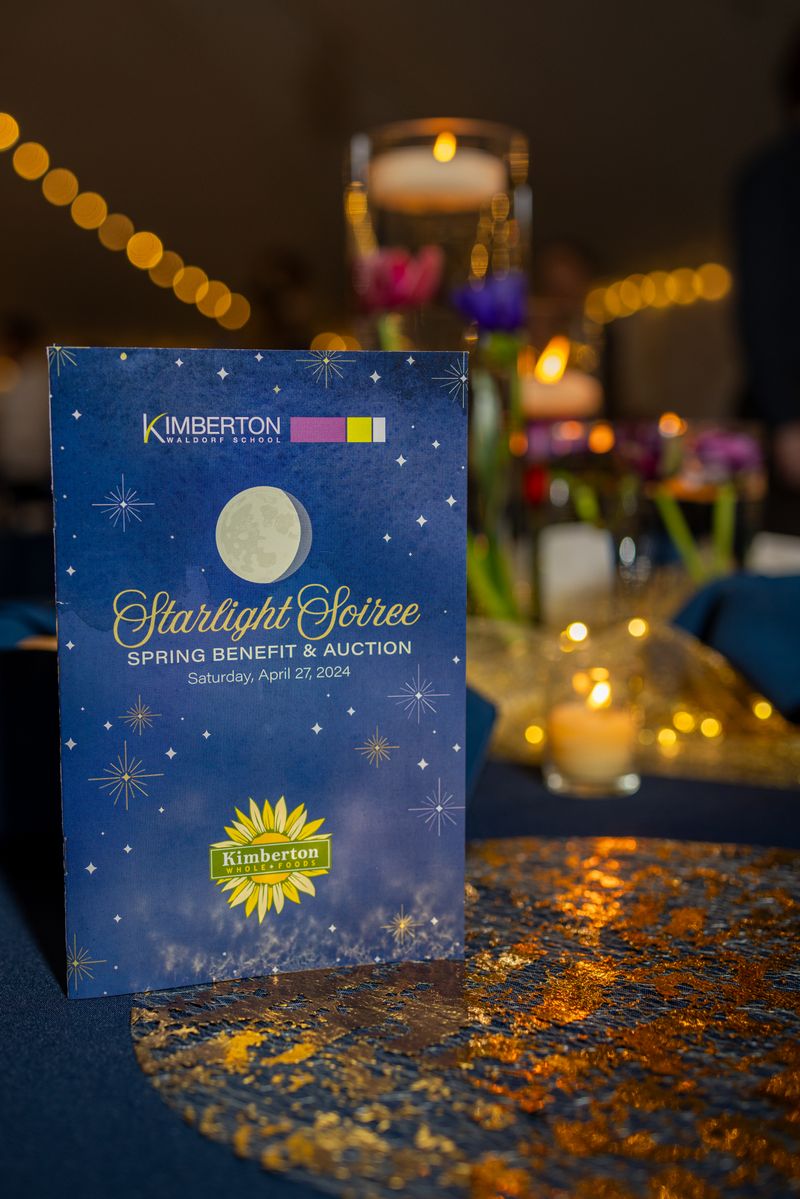 An image of the Starlight Soiree program book, displayed on one of the tables during dinner.
